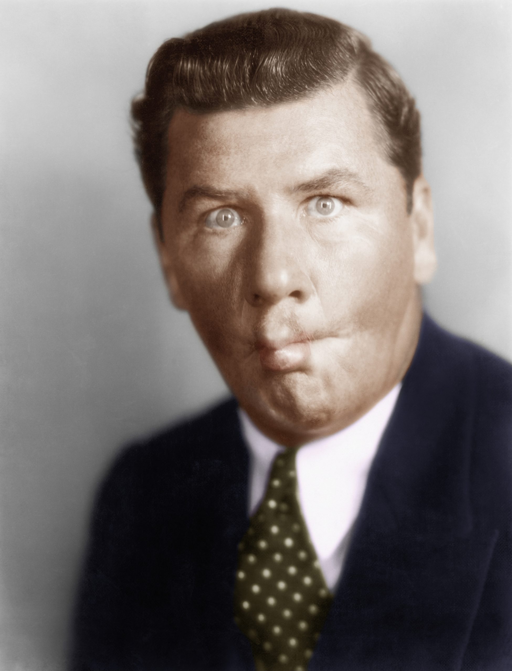 Man sucking in his cheeks  (All persons depicted are not longer living and no estate exists. Supplier warranties that there will be no model release issues.)